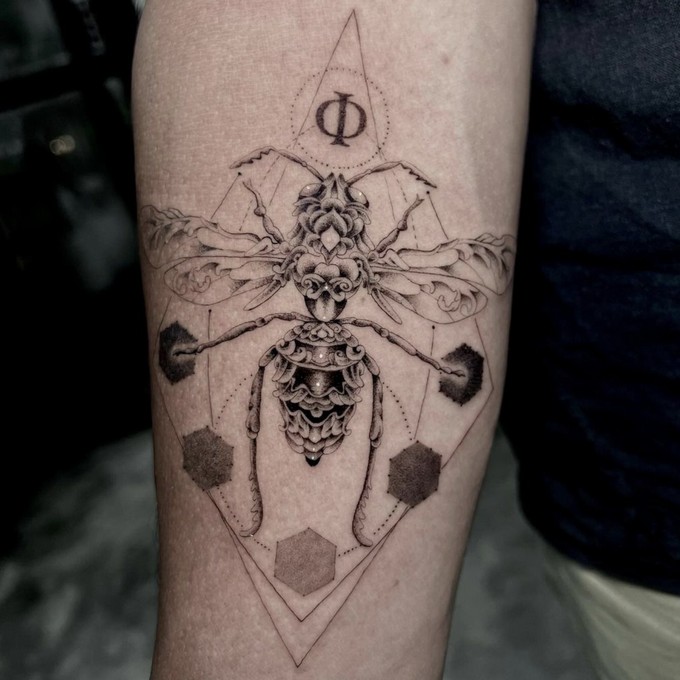 Charlie Rose Tattoo Studio - black tattoo on arm
