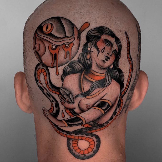 Fox Mulder Bali - a man's head in a tattoo