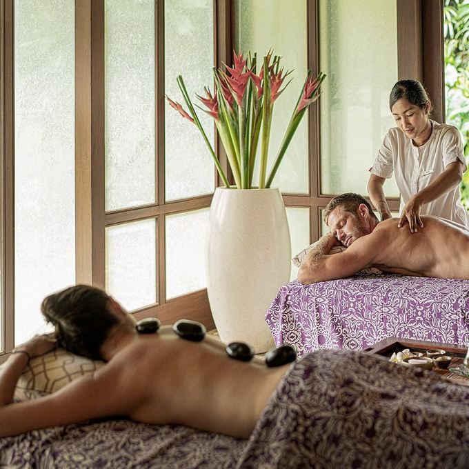 The Sacred River Spa - a woman is doing a massage