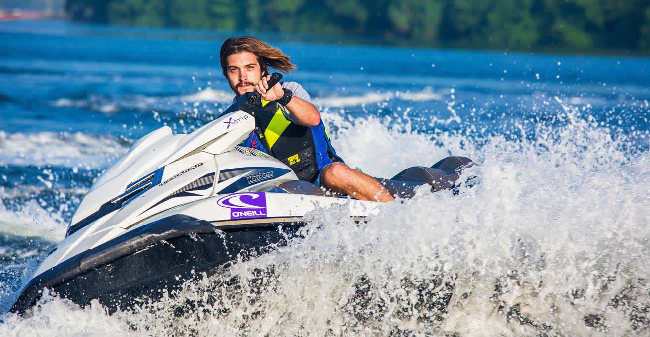 The man is driving jet ski in Bali from one of the best rental companies