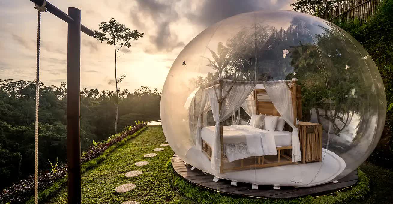 Bedroom inside a huge transparent ball at the Bubble Hotel Bali