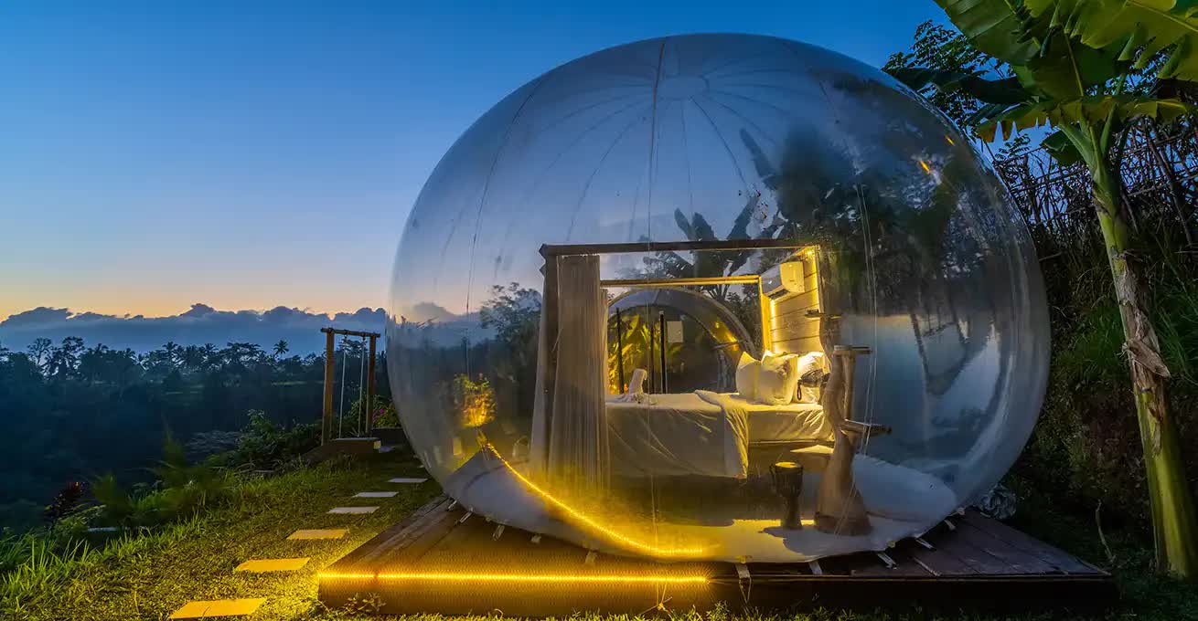 Evening view of bedroom in bubble with lighting at Bubble Hotel Bali