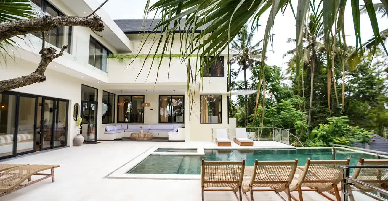 Honey Villa Ubud terrace with swimming pool and seating areas
