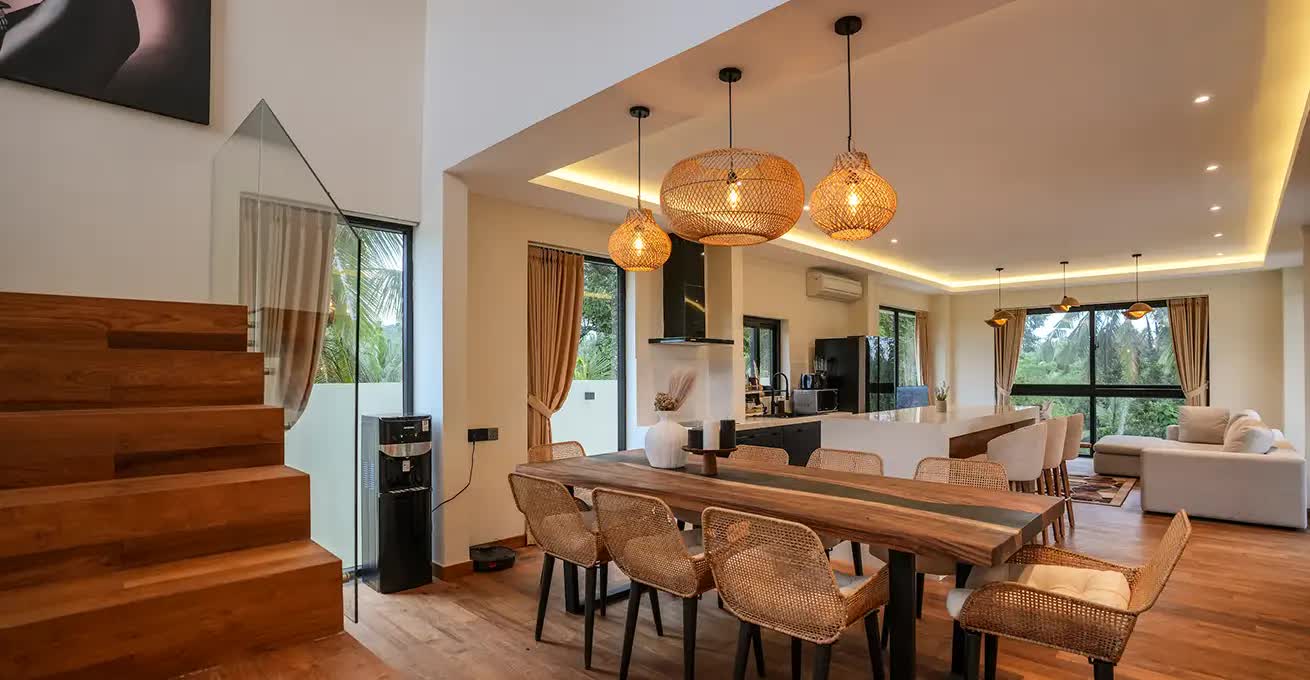 Living room with kitchen and huge windows in Honey Villa Ubud