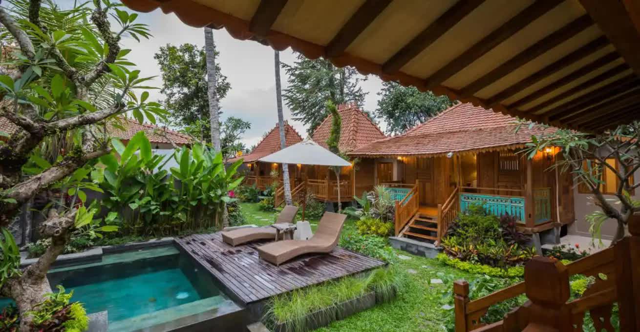 Traditional Balinese little houses and the swimming pool like a part of Kakul Villa Ubud