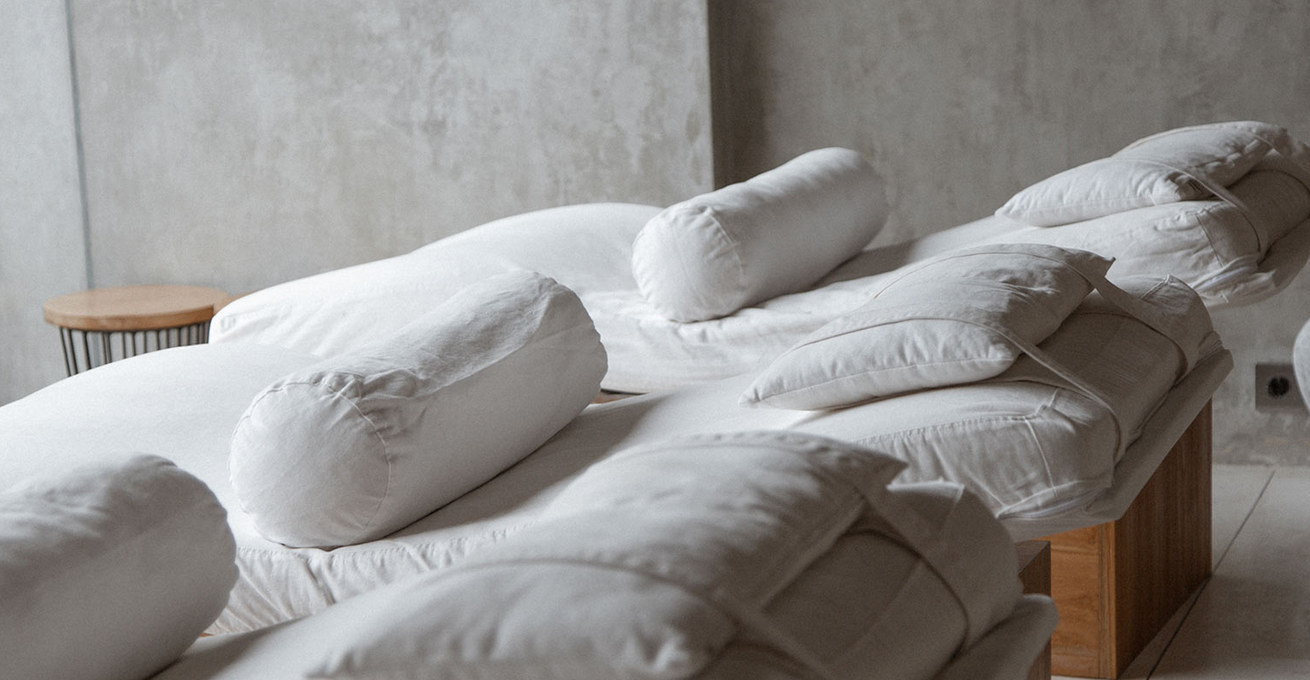 Soft beds with pillows at Jamu Spa