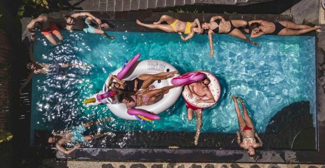 Group of people lying in the pool