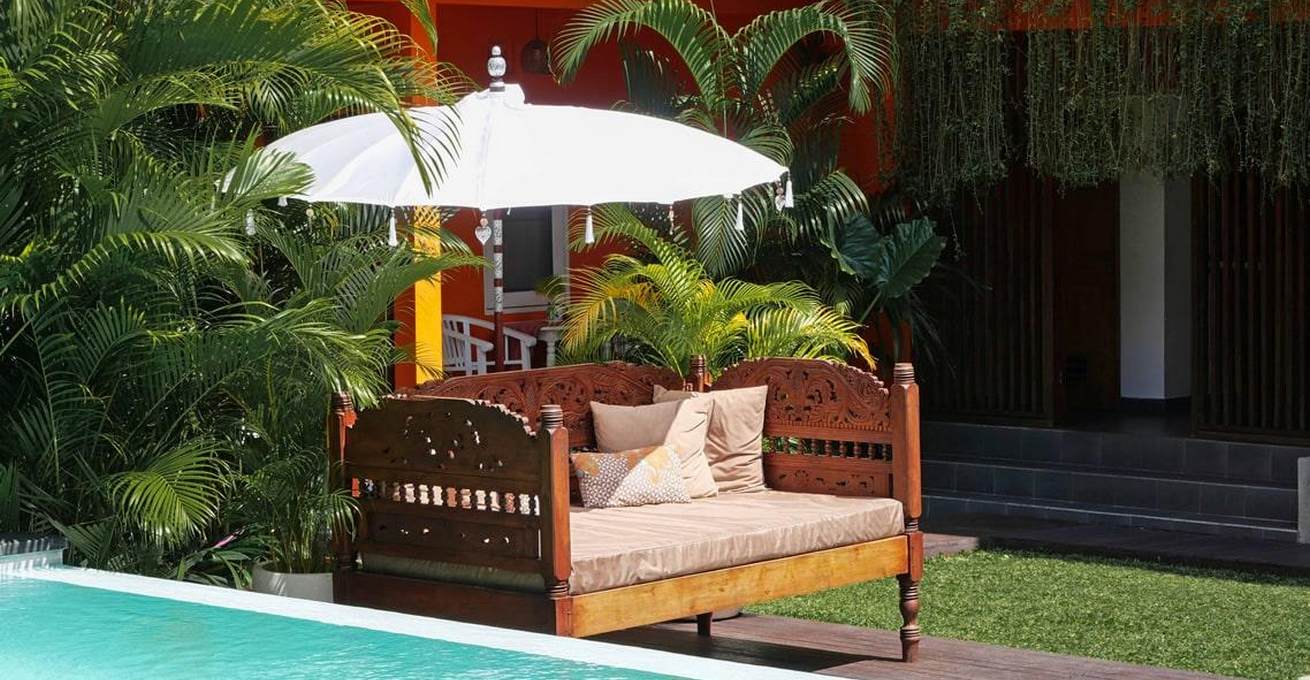 Chair with umbrella near the pool