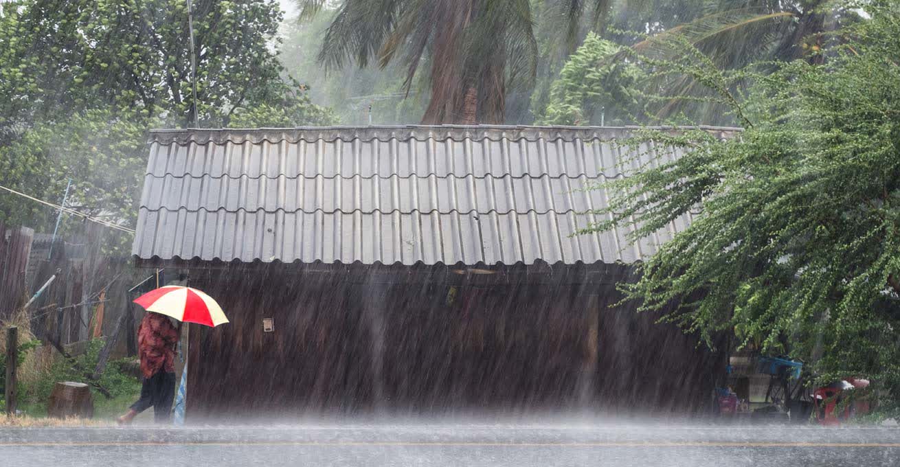 Man under the heavy raining in Bali
