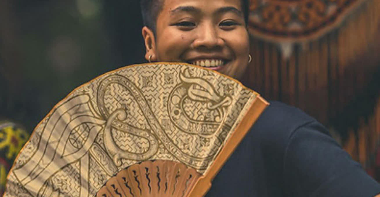 Happy woman with the fan at Bali Spirit Festival