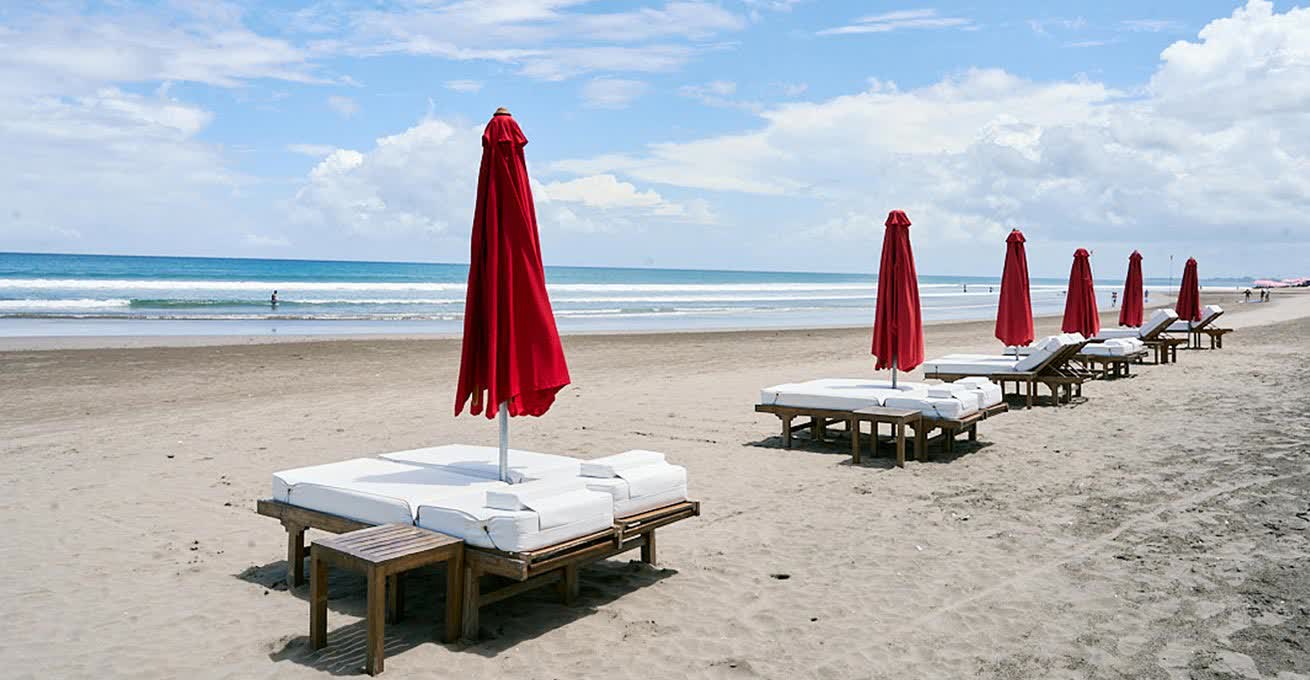 Seats with umbrellas at Kuta Beach