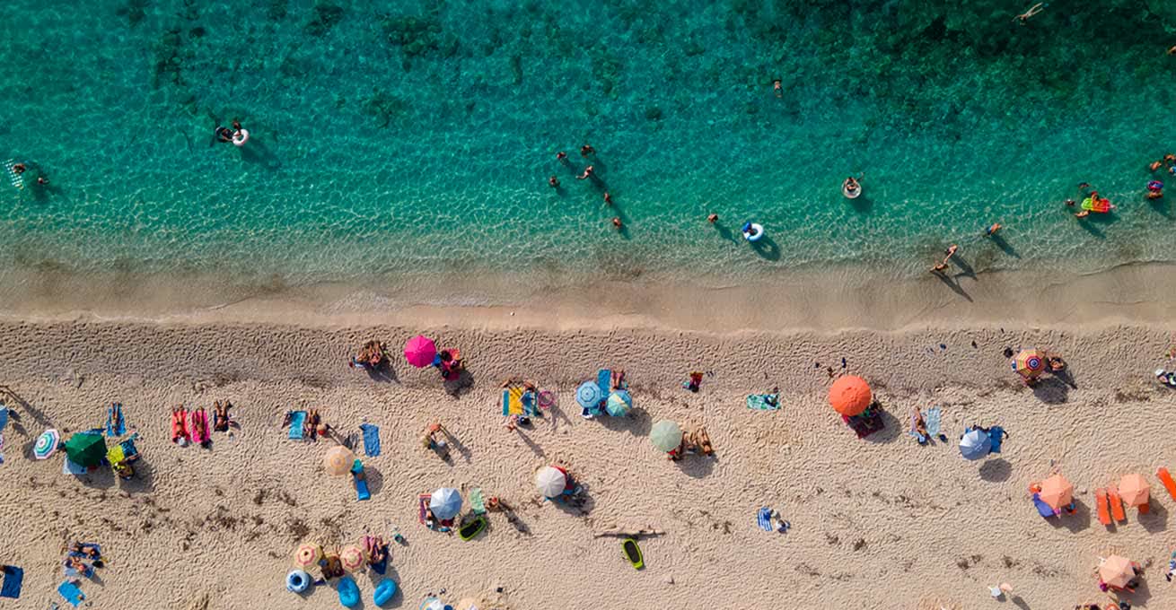 Aerial view of the crowded Padang Padang Beach