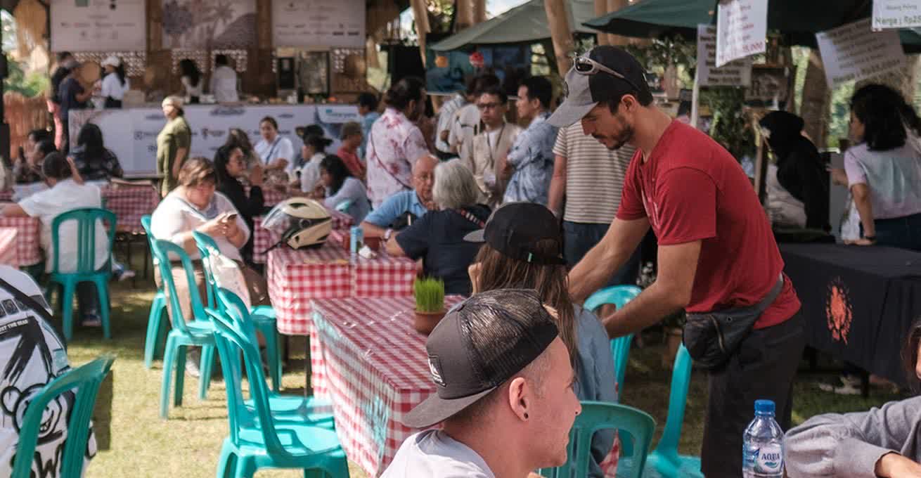 People are tasting an Indonesian cuisine at Ubud Food Festival in Bali